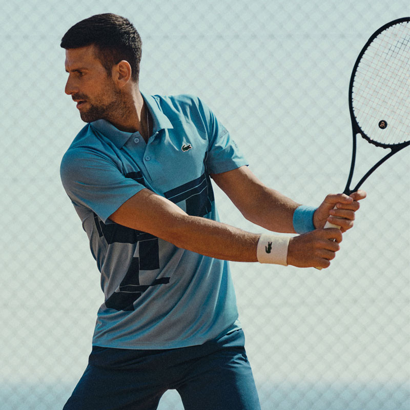 Polo tennis Lacoste Fan Djokovic US Open bleu