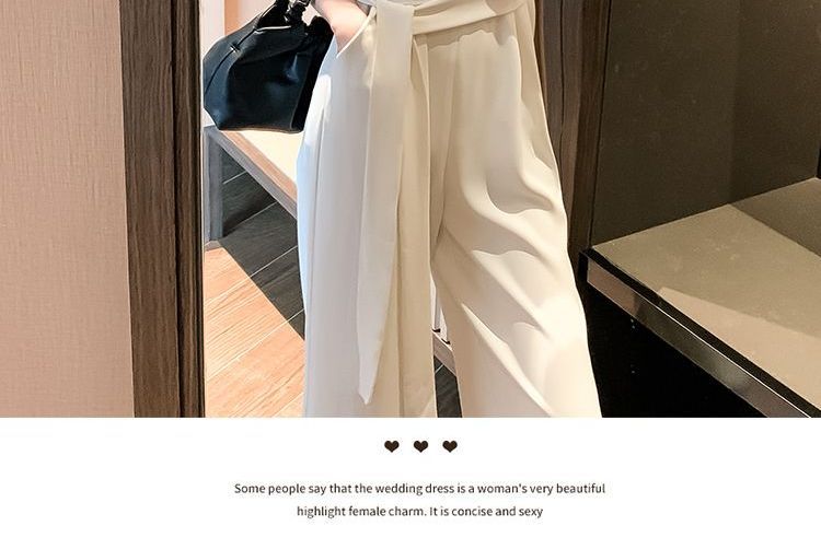 BOHEME - Halter-hals jumpsuit met strik aan de zijkant