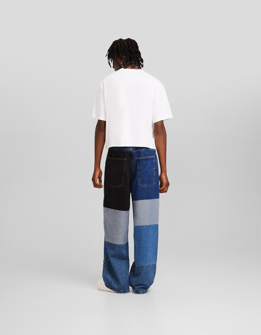 calças jeans super largas com blocos de cores