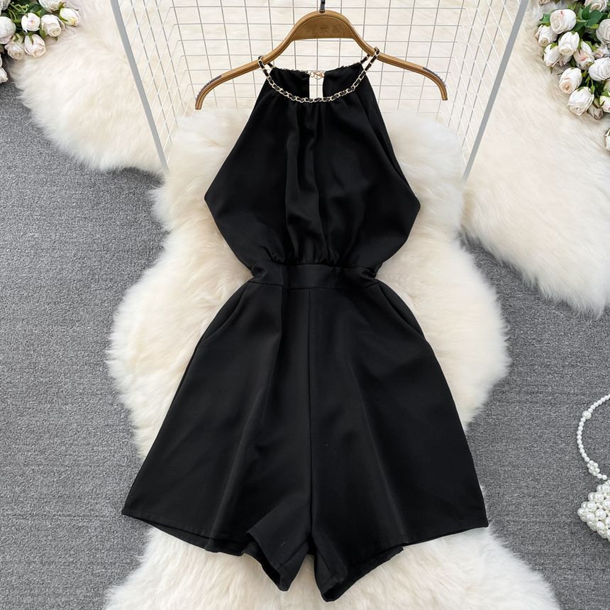 Yearnin - Mouwloze halter romper met wijde pijpen