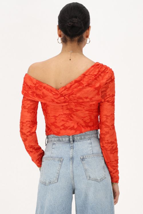 Oranje asymmetrische top met bloemen