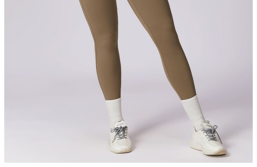 Skinniano - Sportjumpsuit met lange mouwen en halve rits