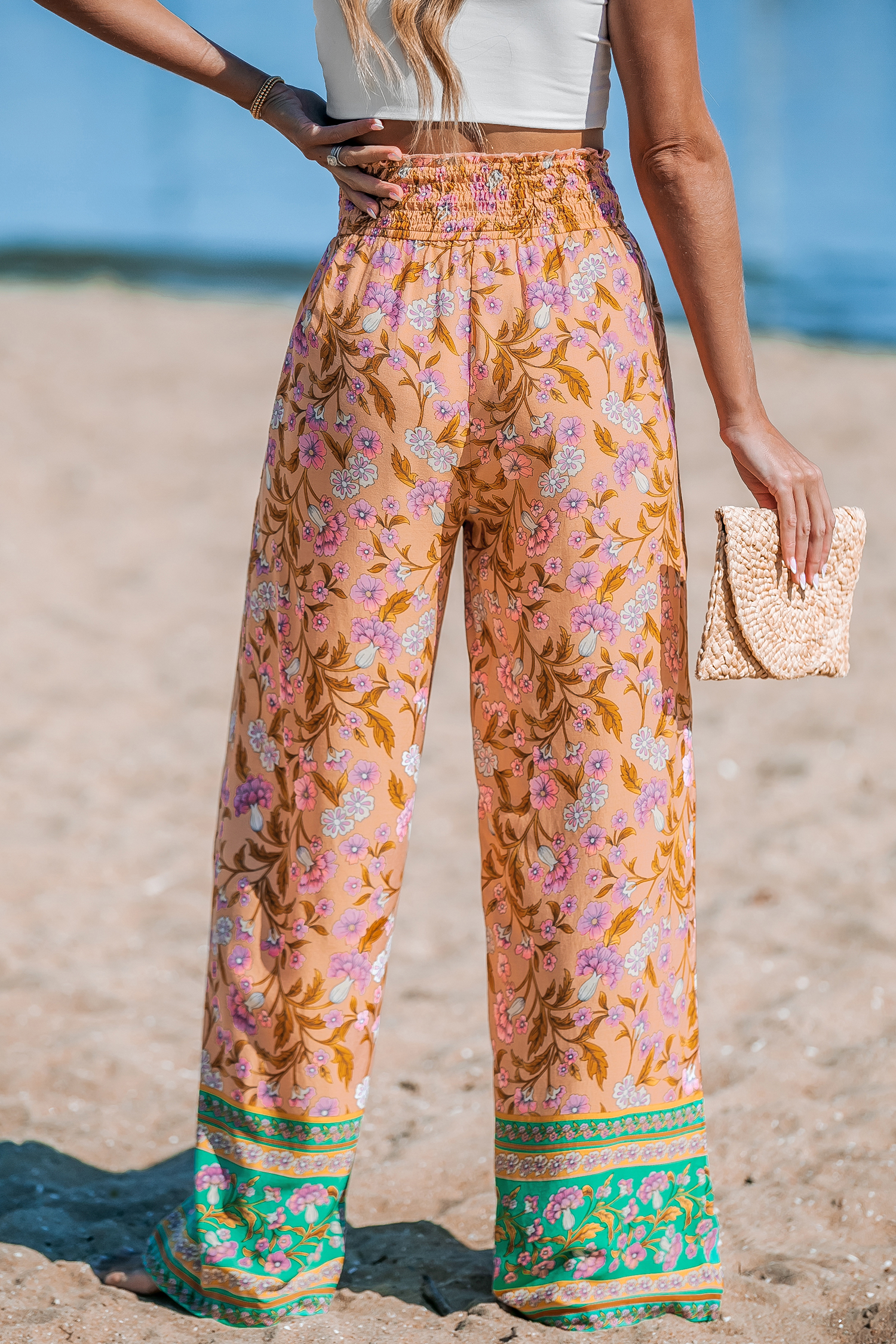 Pantalon fleuri avec jambes droites et taille à smocks orange