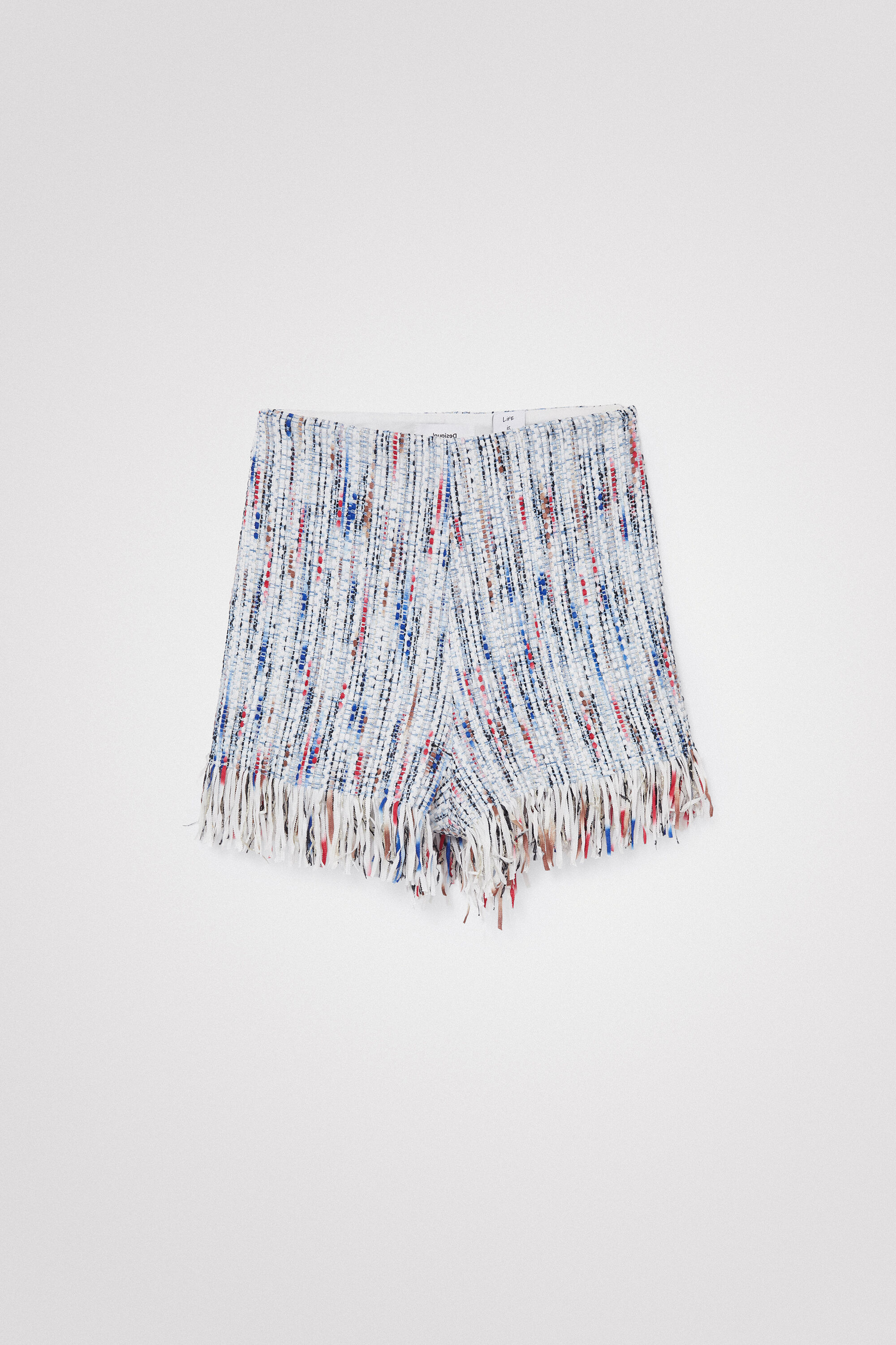 Short en tweed à franges