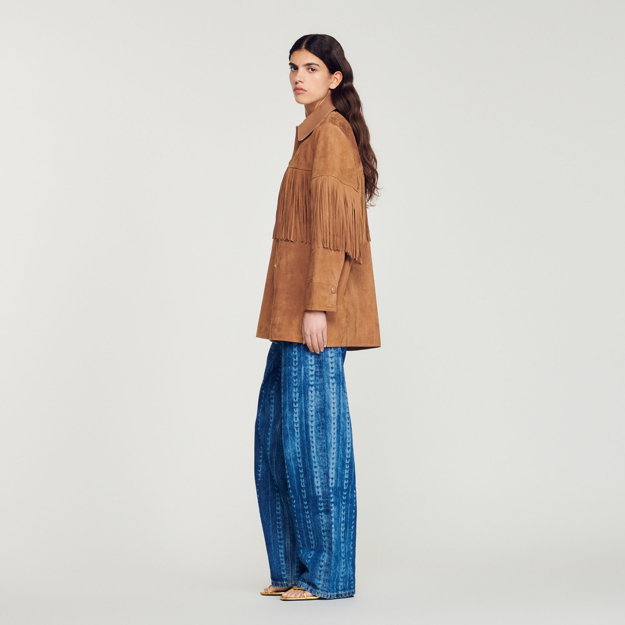 Veste longue en cuir á franges