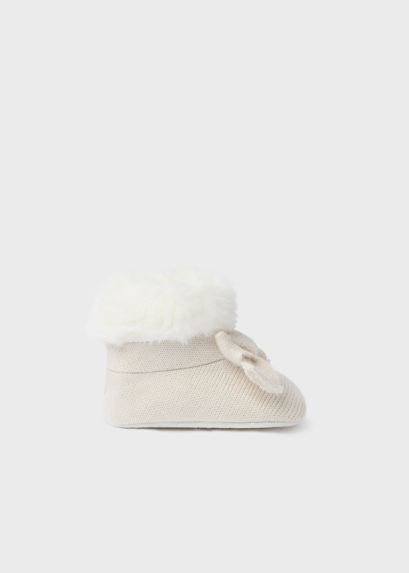 Bota de tricô com pelo de recém-nascido