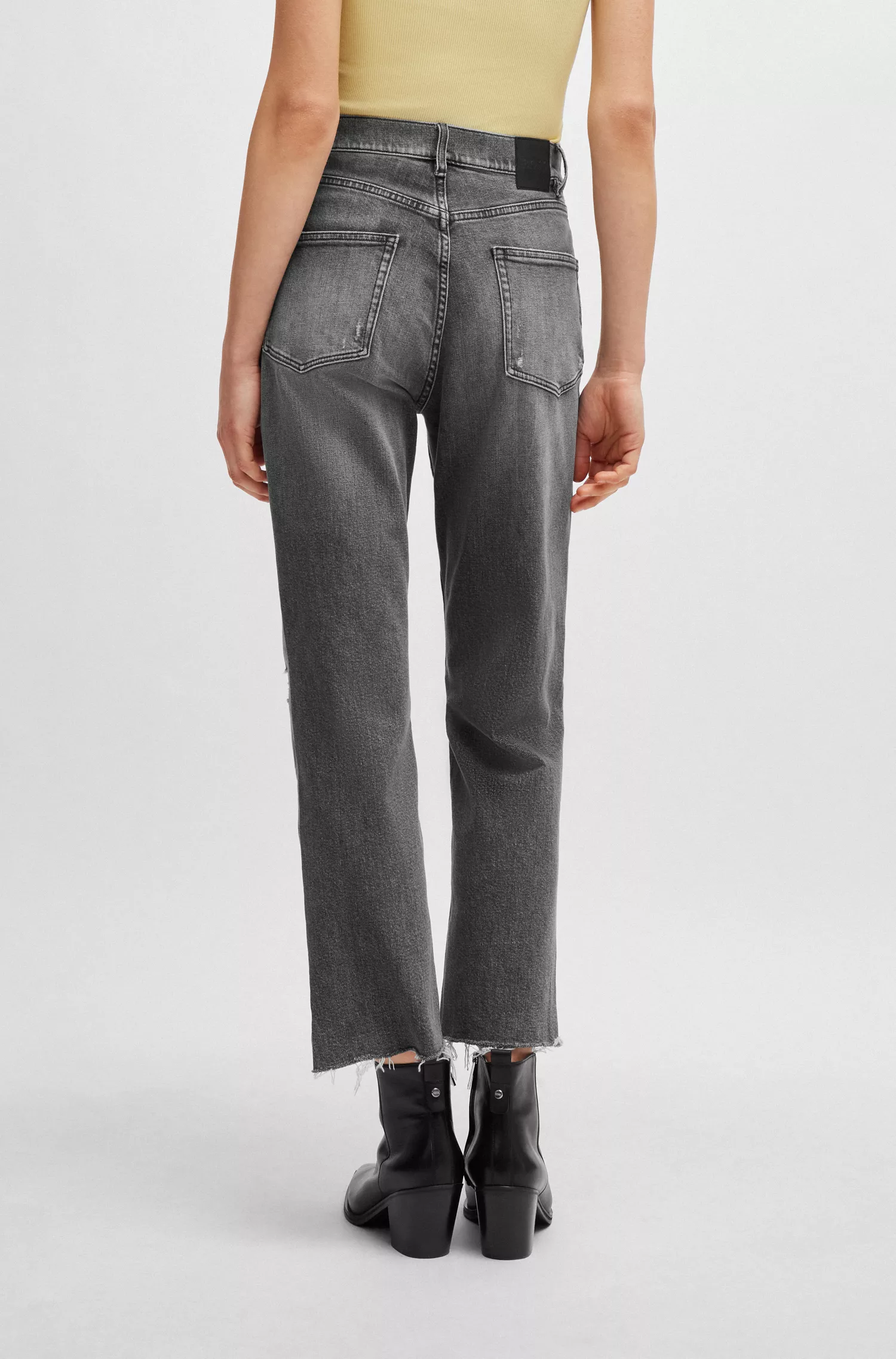Calça jeans BOSS laranja, corte slim, em denim stretch cinza.