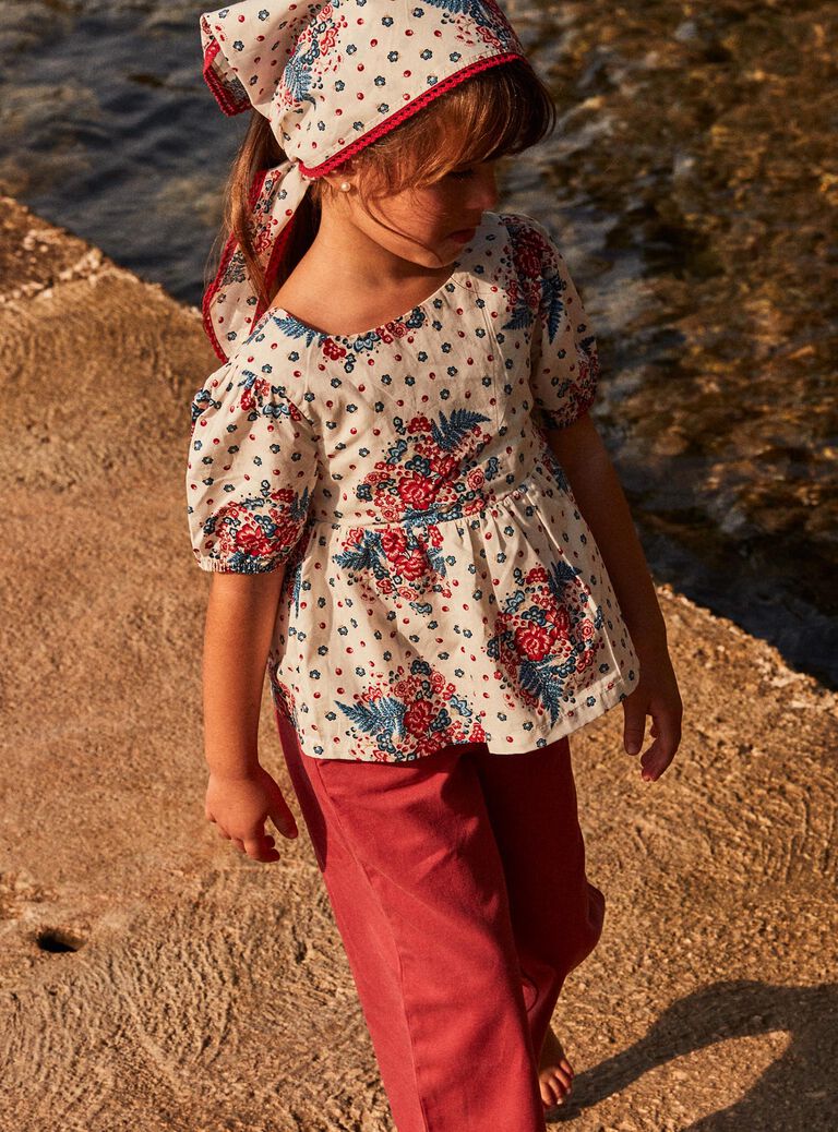 Blouse écrue à lanières croisées au dos