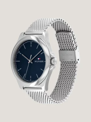 Relógio com pulseira de malha e mostrador azul com efeito raios de sol