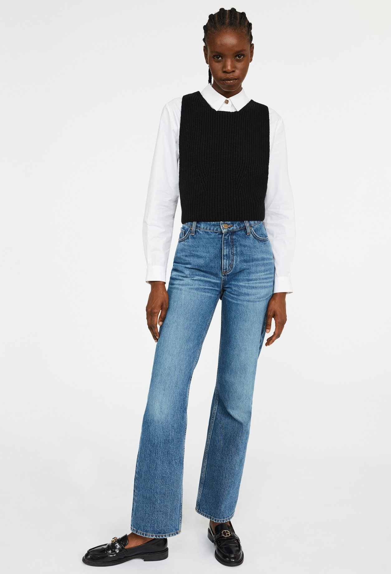 Pull sans manche croise dans le dos