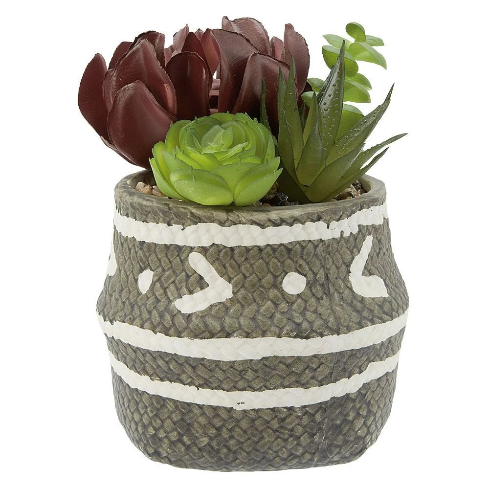 Plante artificielle dans pot en forme de panier en céramique