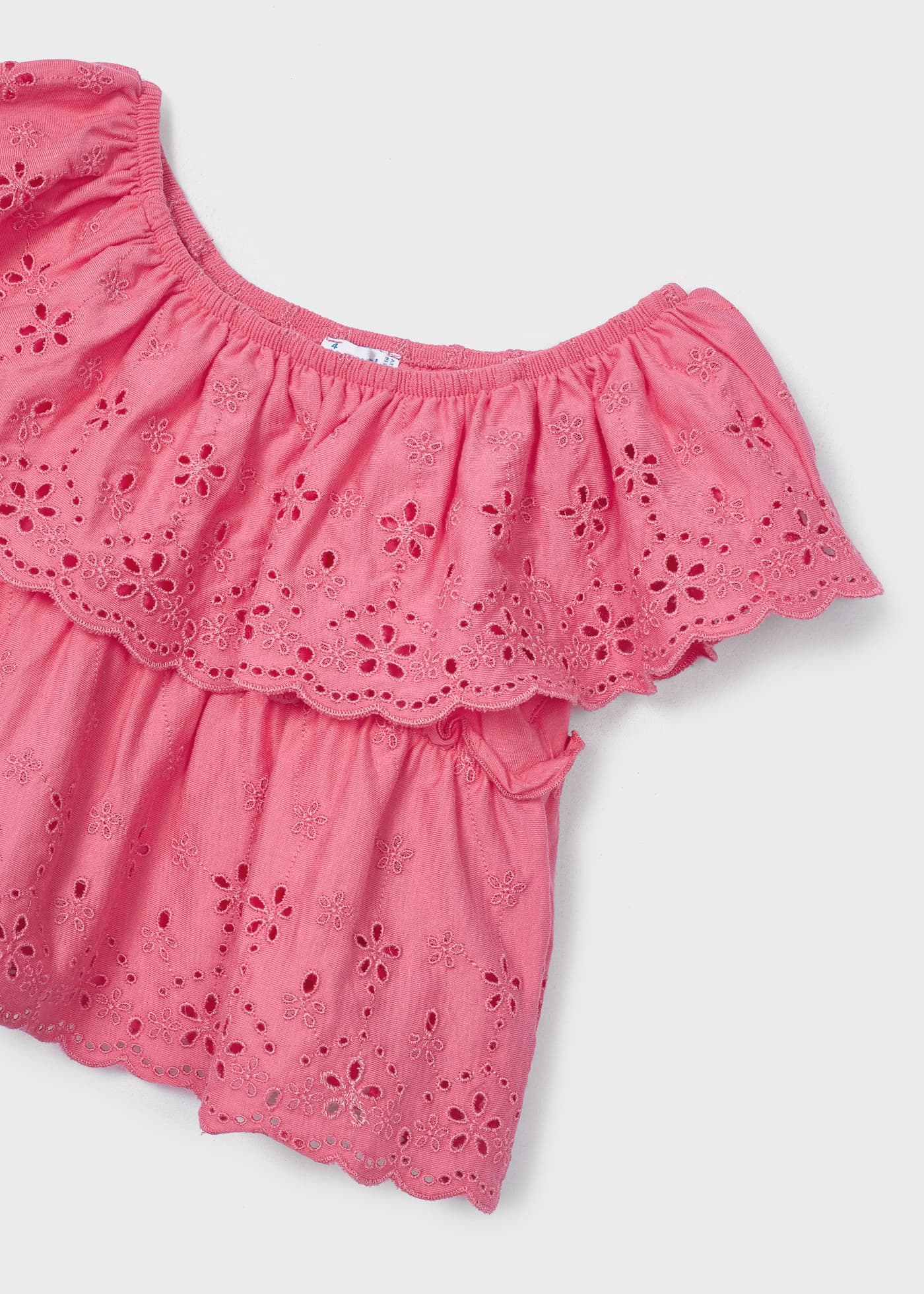 Blusa com motivos perfurados, feita de algodão sustentável, para meninas.