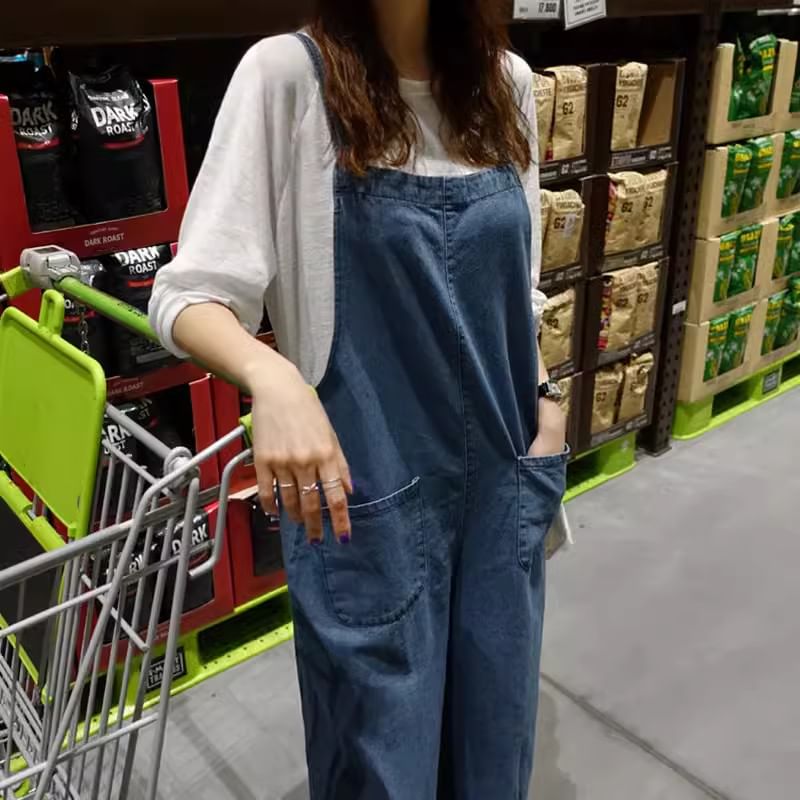 Felixia - Mouwloze denim jumpsuit met wijde pijpen