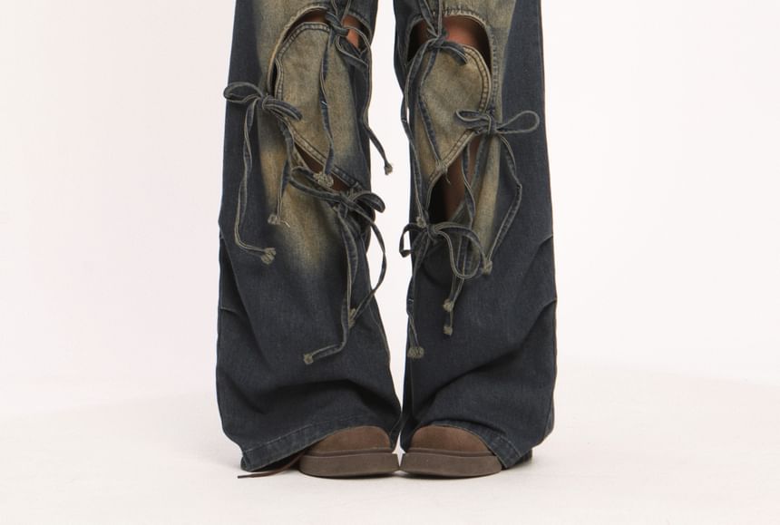 Berrytrix - Lage taille jeans met strikaccent en uitsparingen, gewassen en wijde pijpen