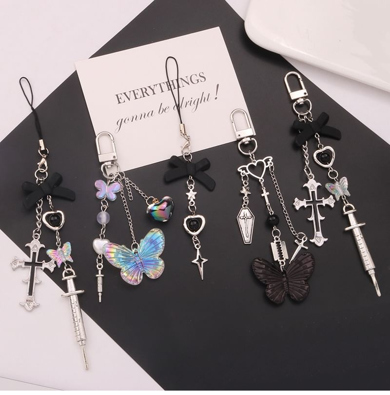 Jenorey - Sleutelhanger met vlinder-/kruistashanger (verschillende ontwerpen)