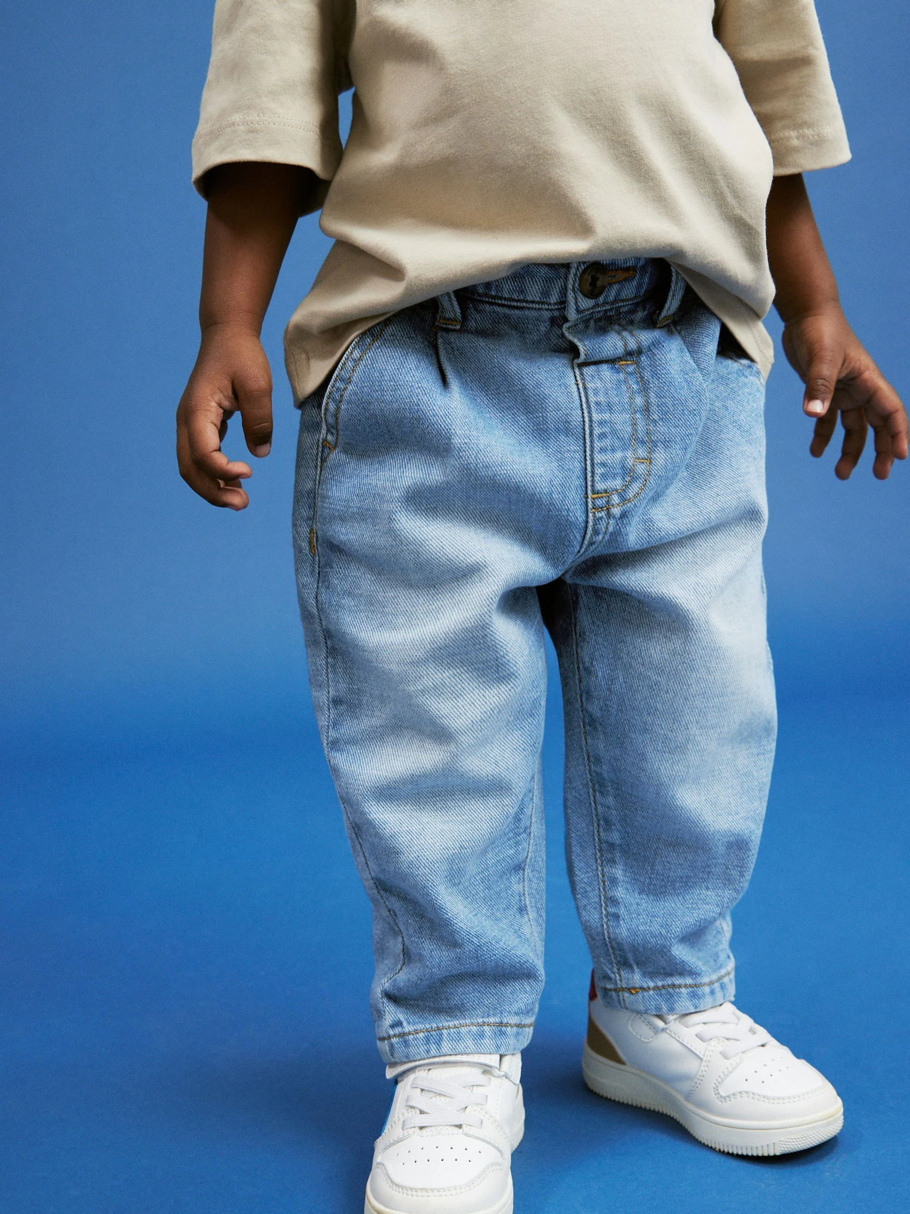 Lichtblauwe denim - Jeans met geplooide voorkant (3mnd-7jr)
