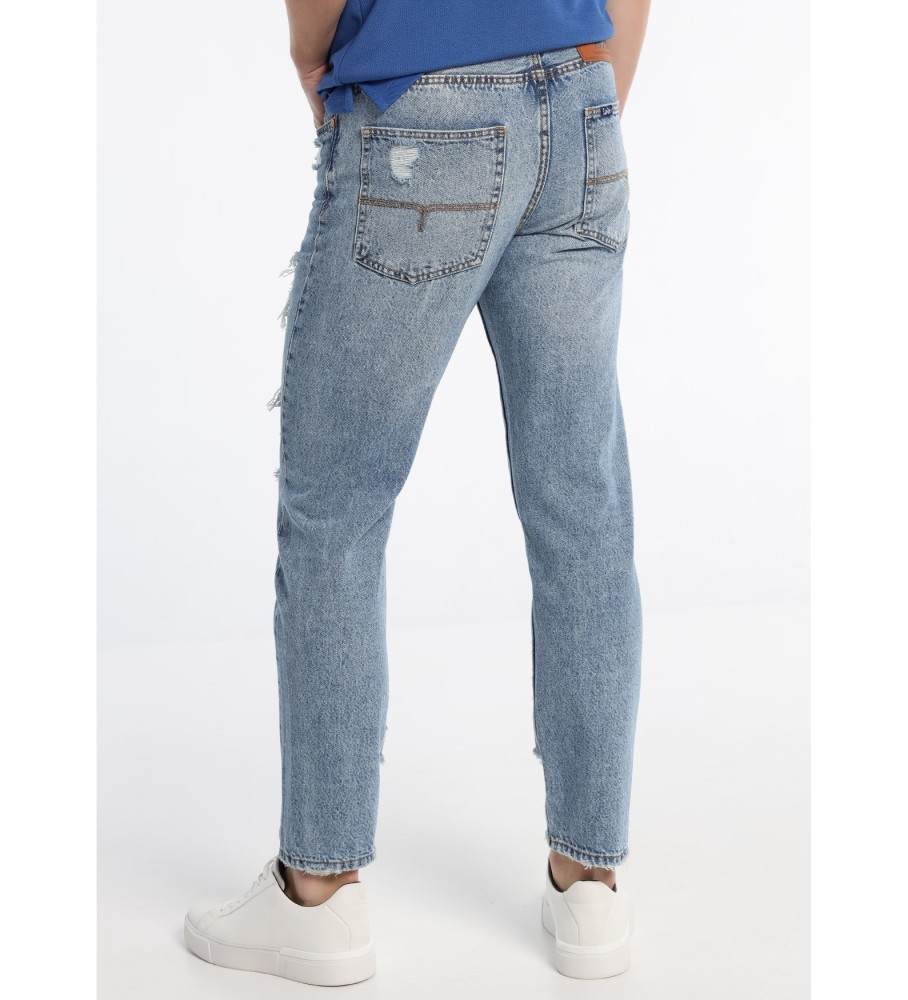 Calça jeans Lois Jeans tamanho médio com leves danos, modelagem vintage, branca.