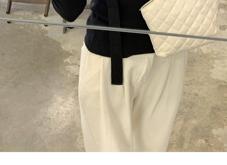 Joyciful - Asymmetrische, effen gebreide top met lange mouwen en off-shouldermotief