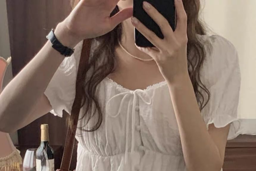 minaga - Effen blouse met kanten rand en pofmouwen