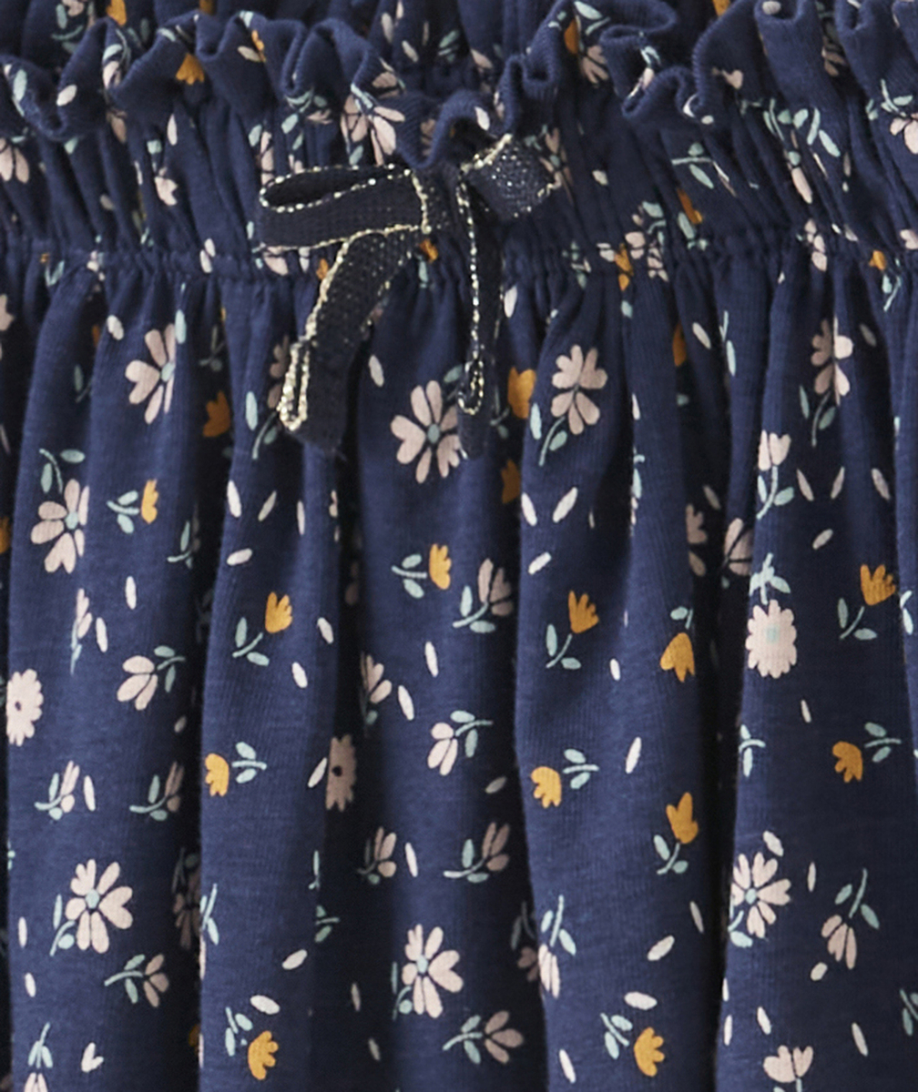 JUPE EN MAILLE FILLE BLEU MARINE ET IMPRIMÉE FLEURIE