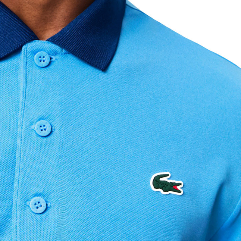 Polo tennis Lacoste Fan Djokovic US Open bleu