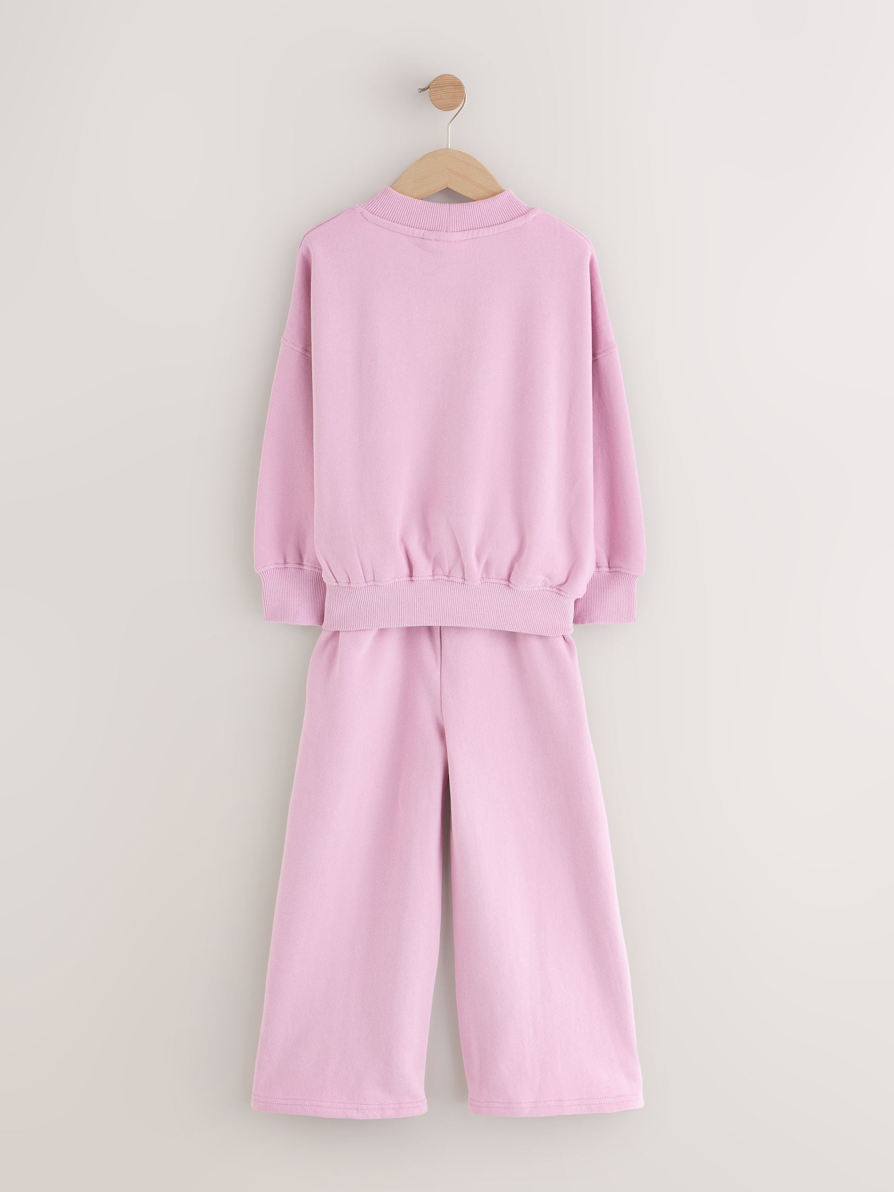 Roze met slogan - Set van sweatshirt en joggingbroek met wijde pijpen (3-16jr)