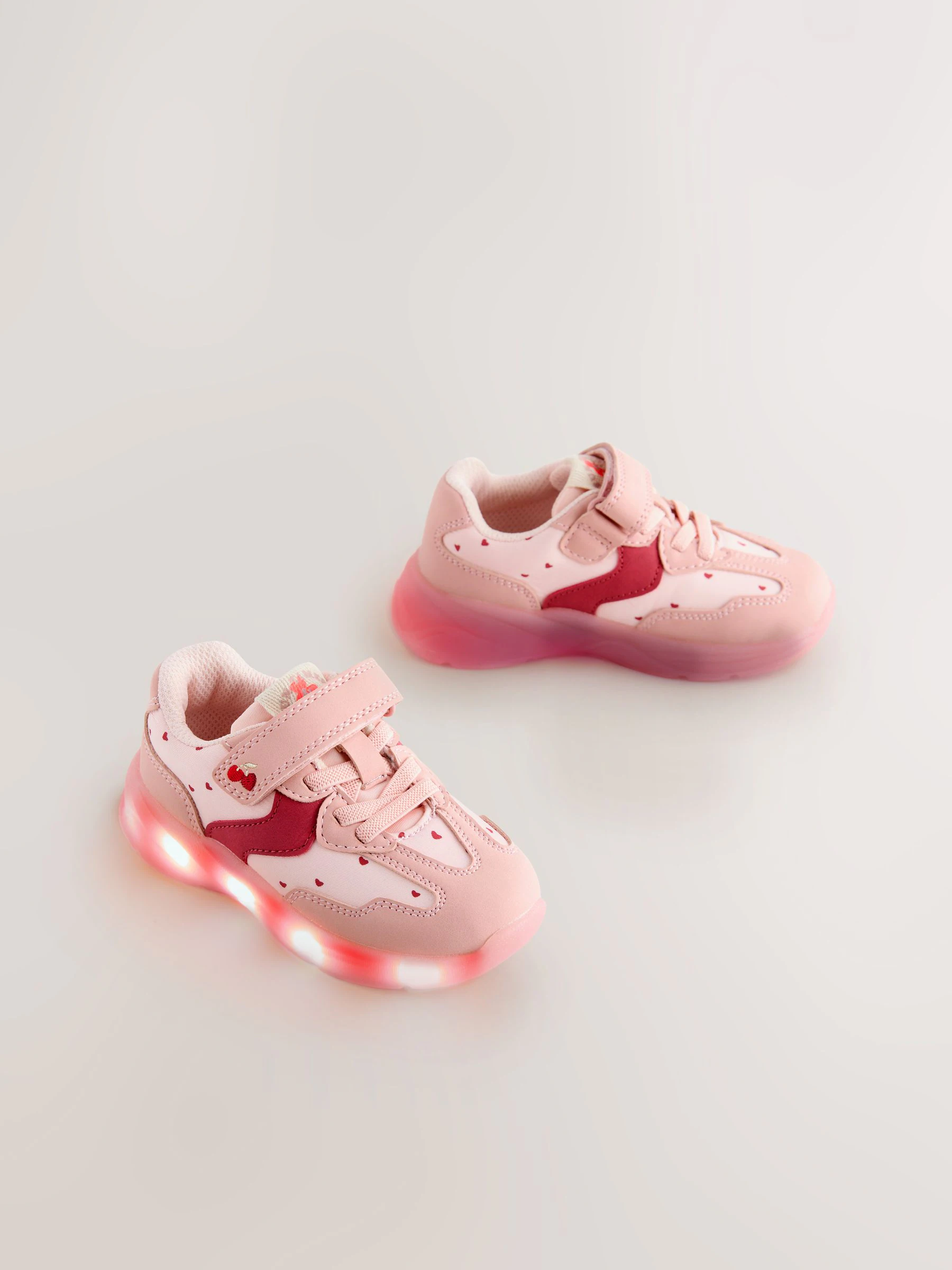 Roze met hartjesprint - Oplichtende sneakers met klittenbandsluiting en elastische veters