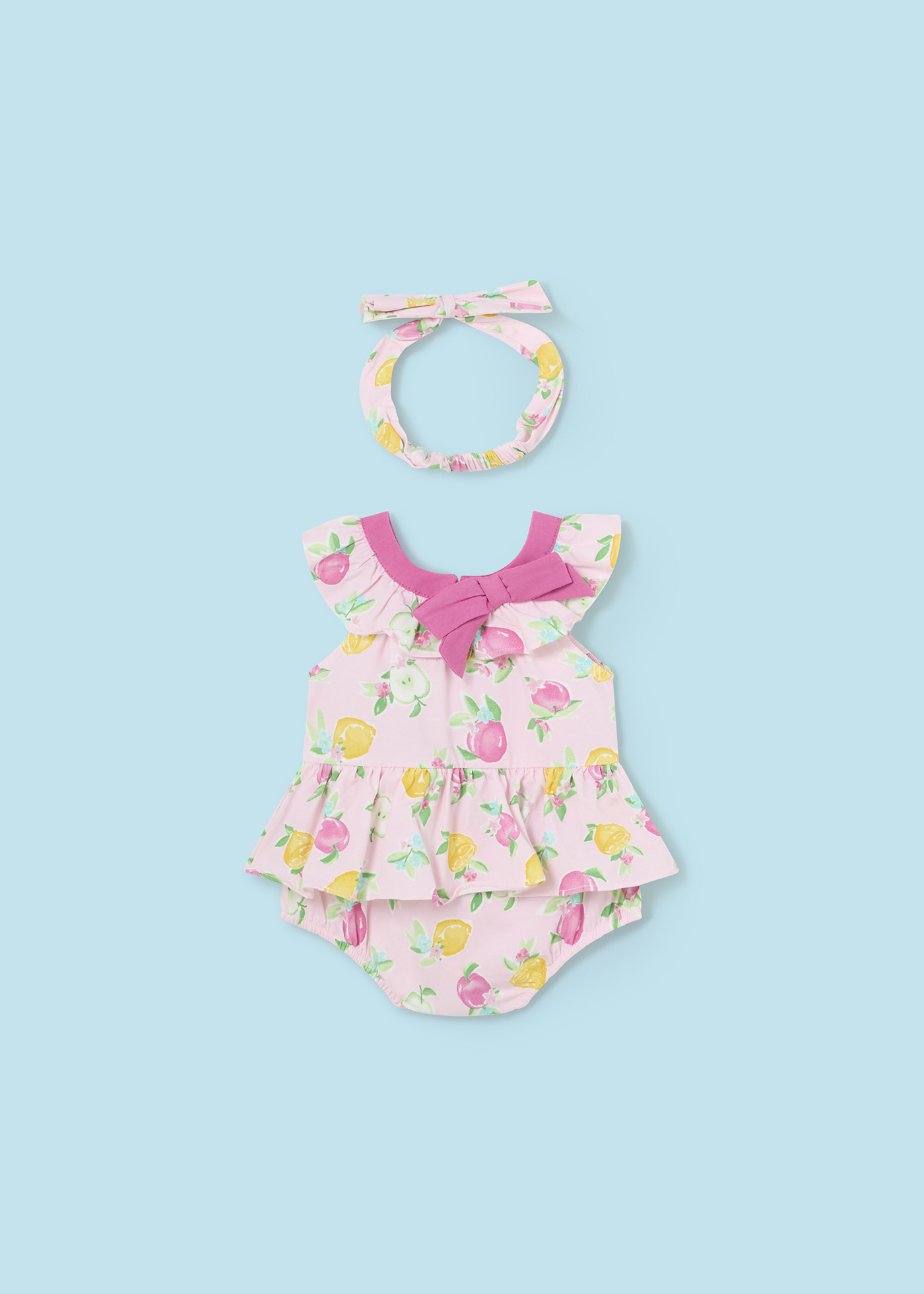 Macacão Better Cotton Juicy para recém-nascido com faixa de cabeça e estampa de frutas.