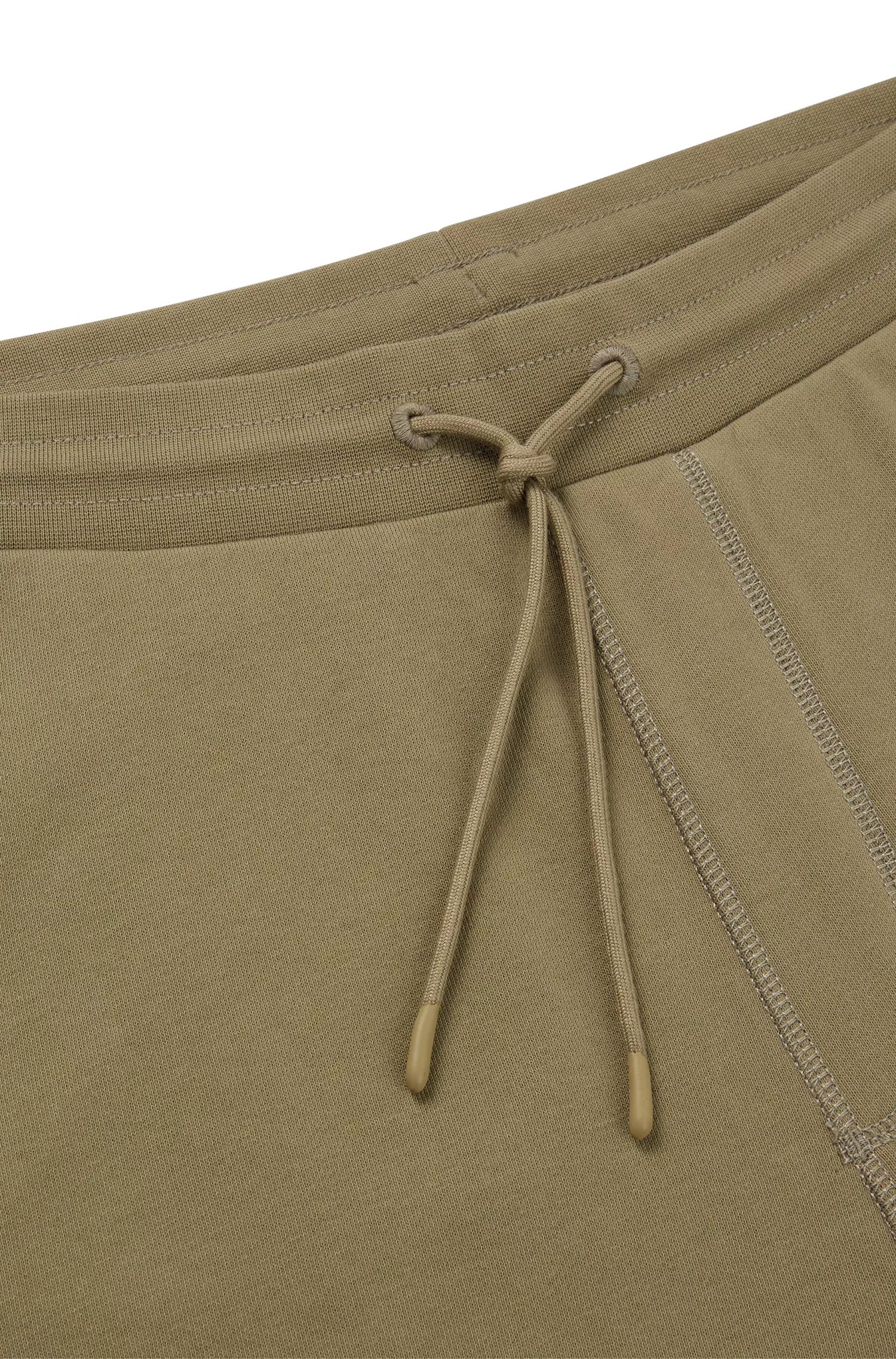 Calça de fato de treino BOSS laranja em tecido atoalhado de algodão com etiqueta com o logótipo