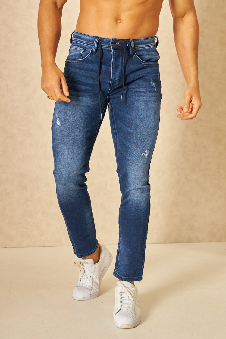 Jeans slim bleu déchiré avec élastique à la taille