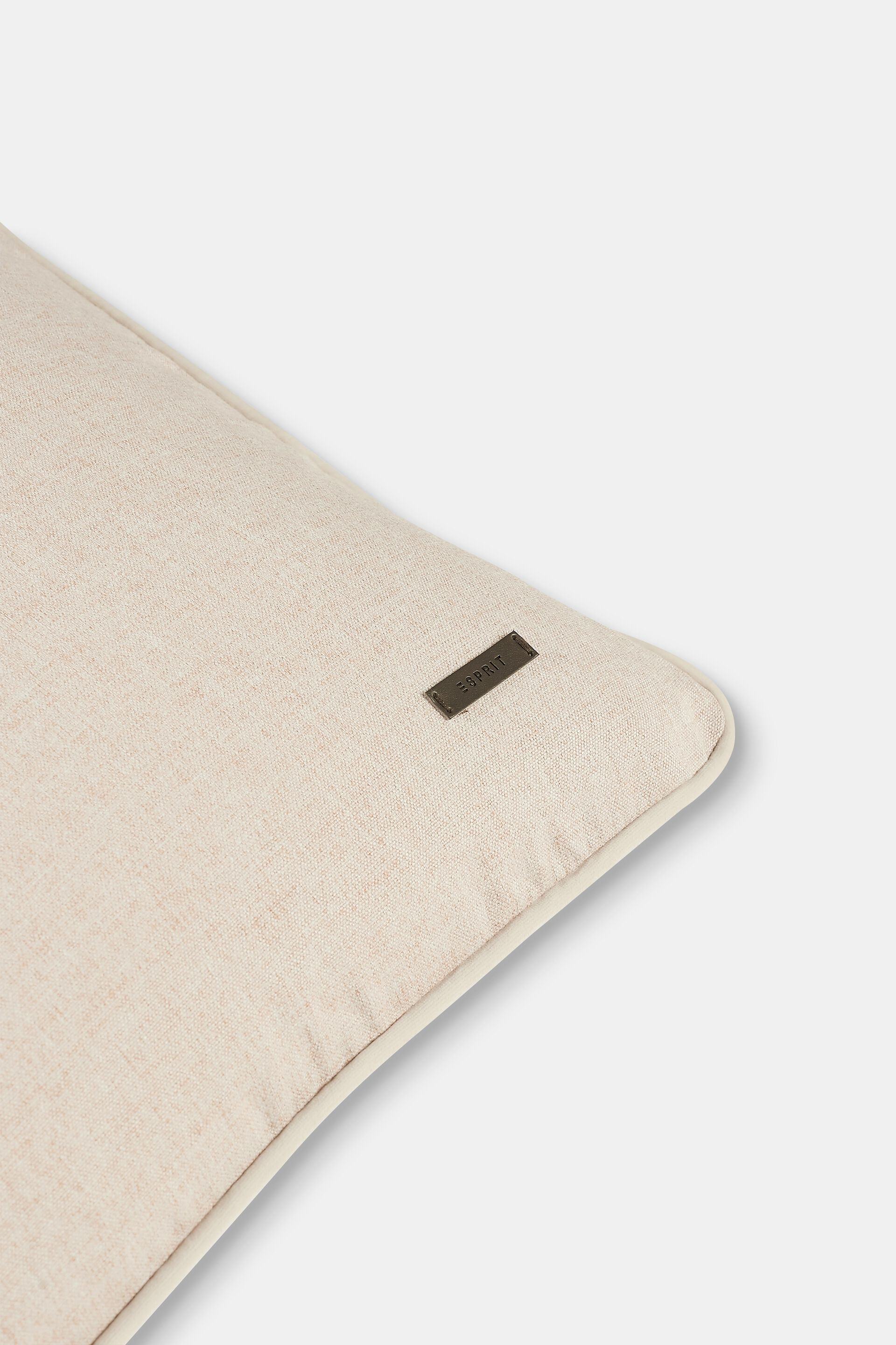 Housse de coussin décorative rehaussée d’un passepoil en velours
