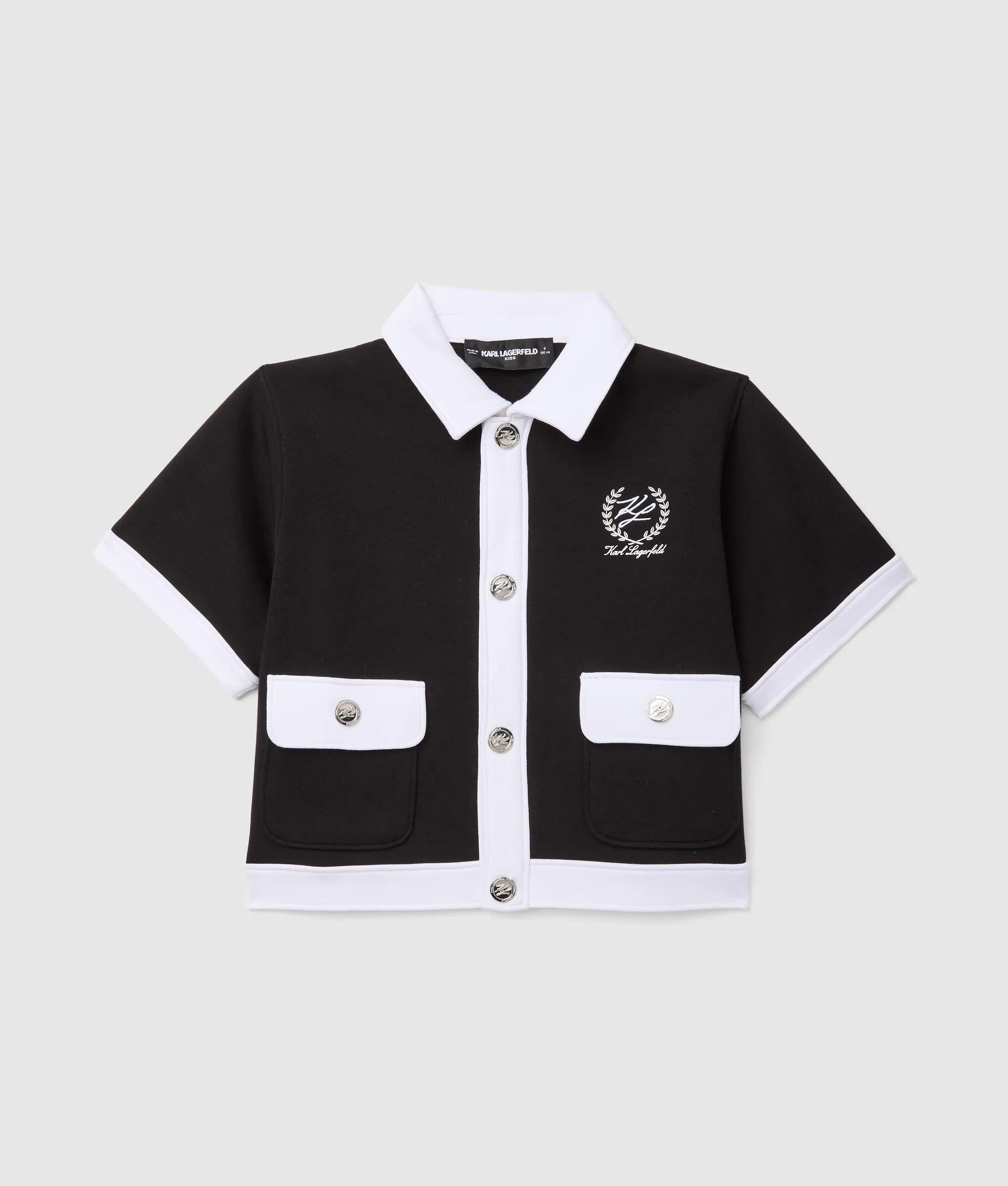 Meisjes vest met korte mouwen en paspels