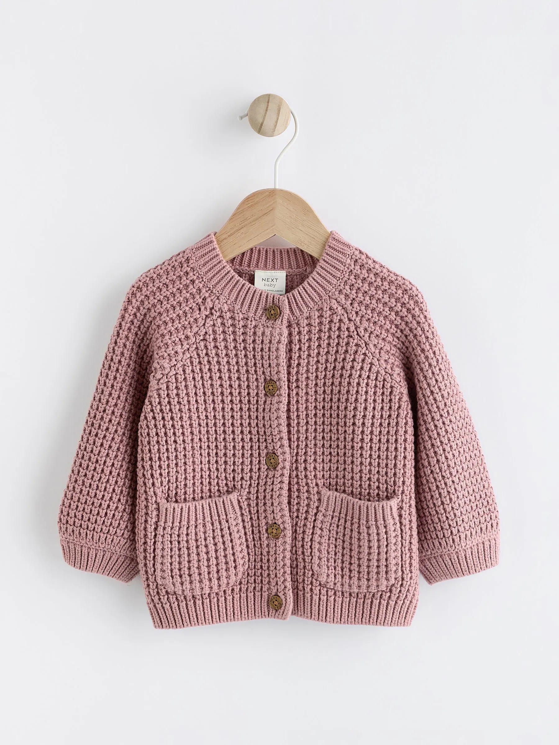 Roze - Gebreid babyvestje met geborduurde slogan op de rug (0mnd-2jr)
