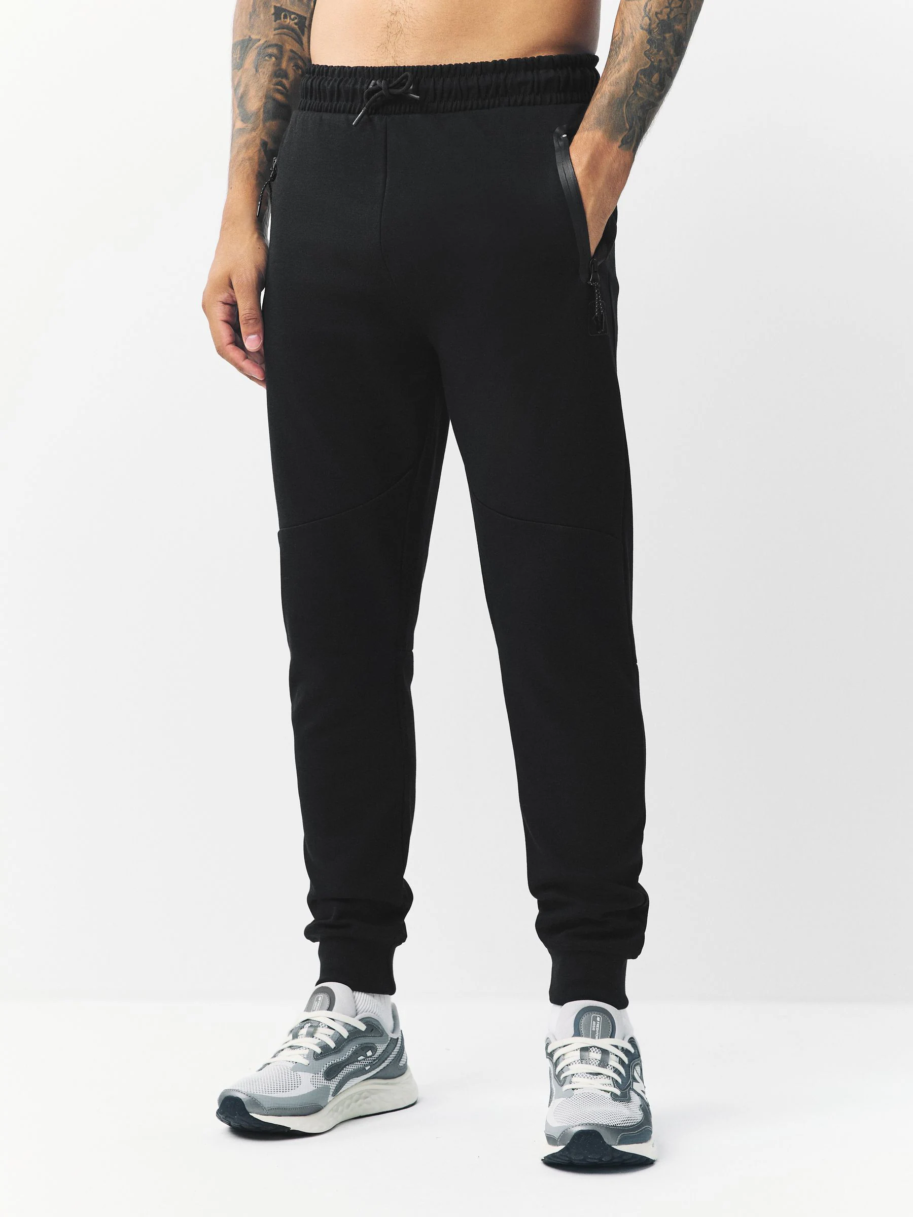 Zwart - Sport- en vrijetijdsjoggingbroek met boorden