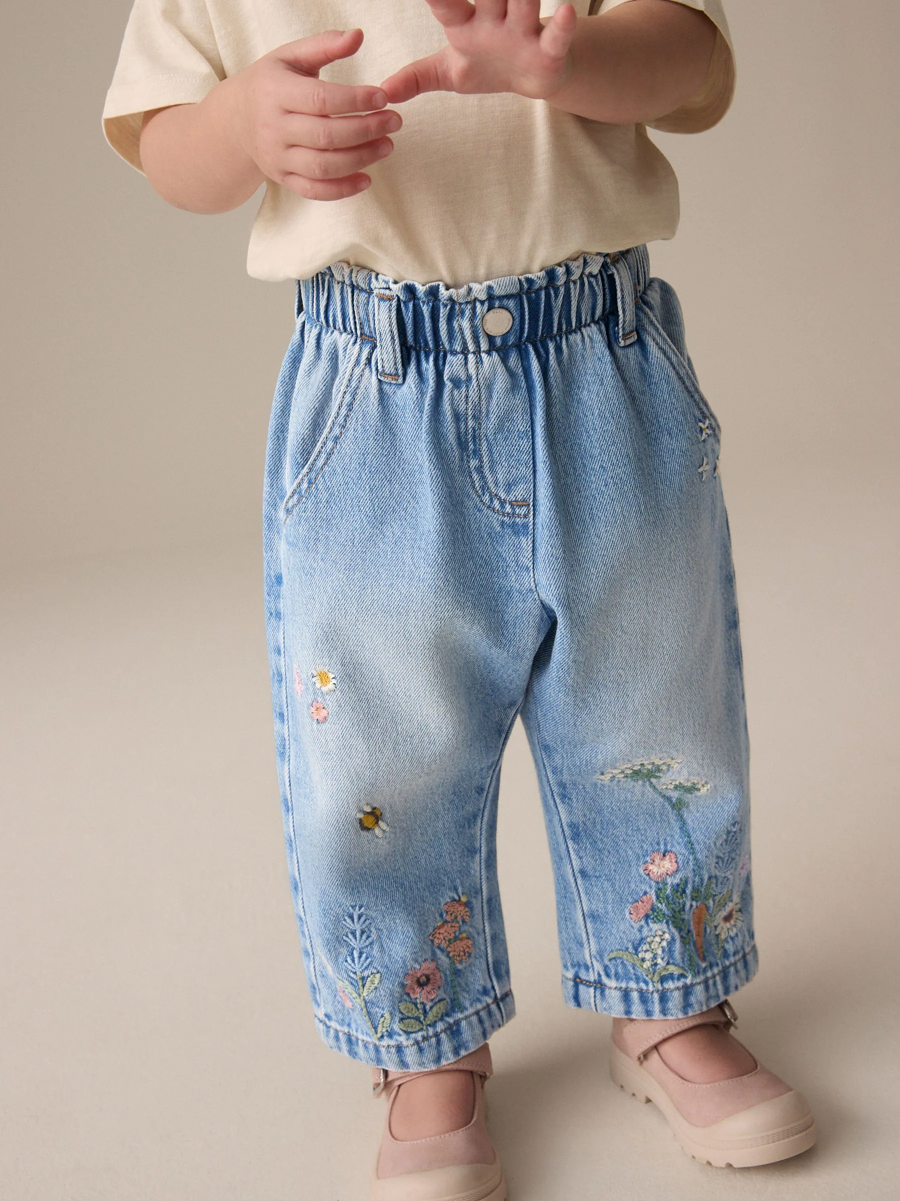 Denim - Jeans met toelopende pijpen en geborduurde bloemenprint (3mnd-7jr)