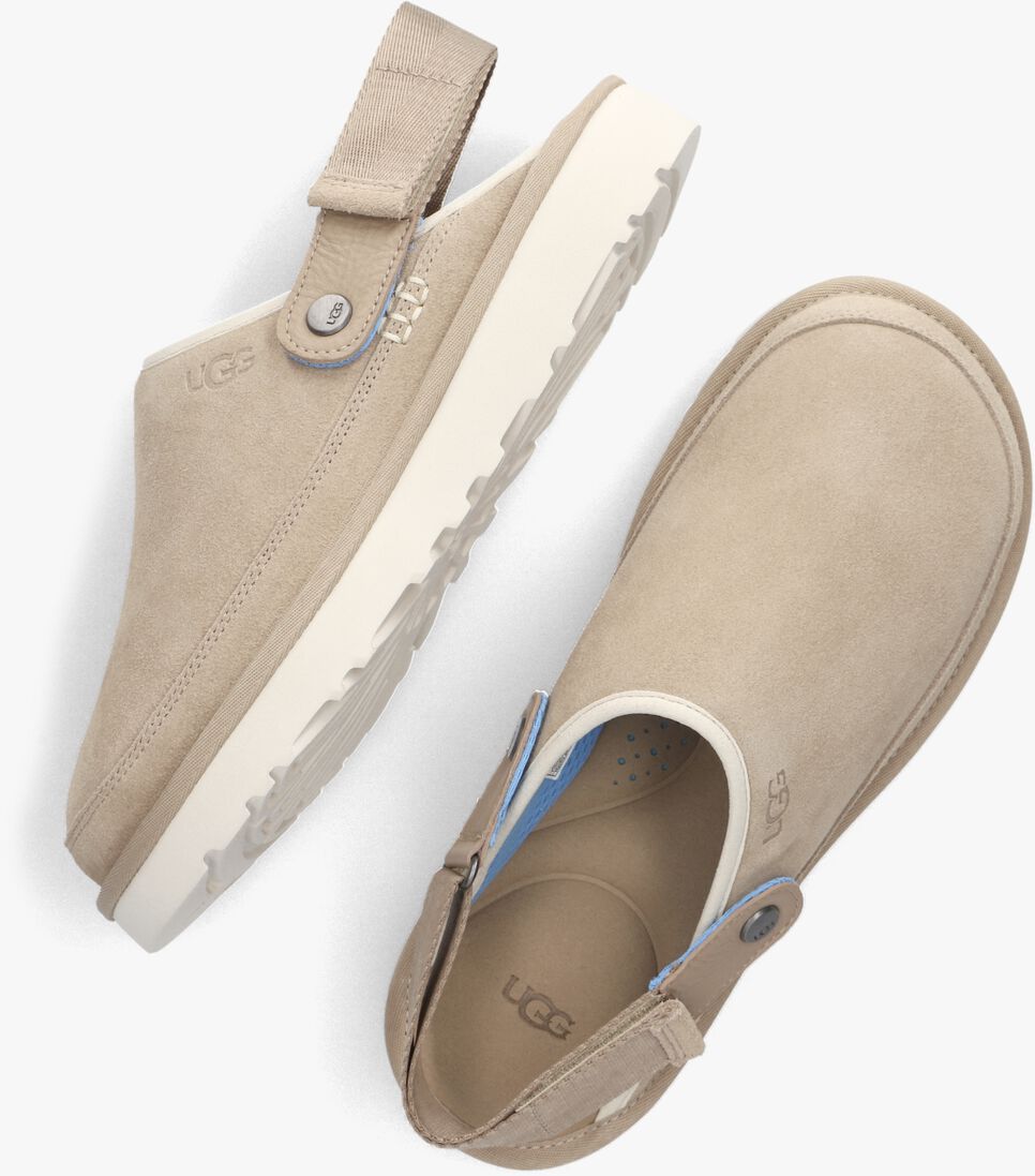 beige ugg slippers marketing model