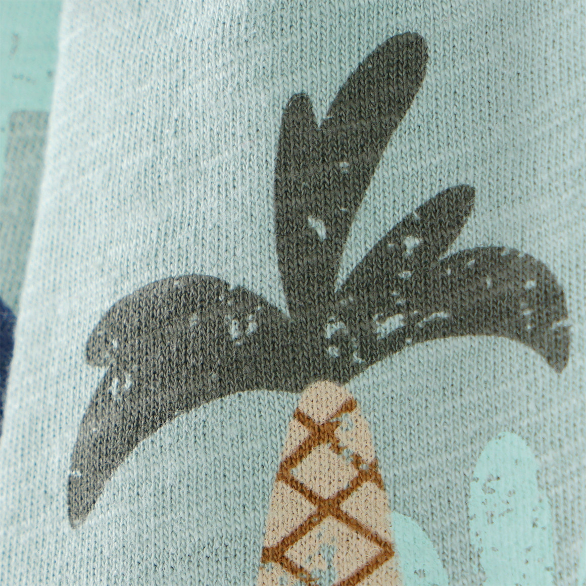 Topomini Baby Joggingshort mit Dino-Motiven salbei / bunt