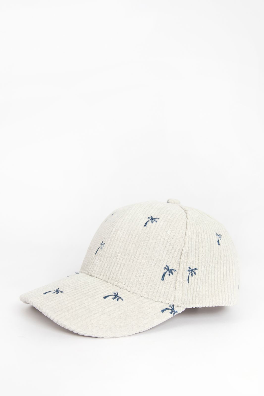 Beige corduroy pet met palmbomen