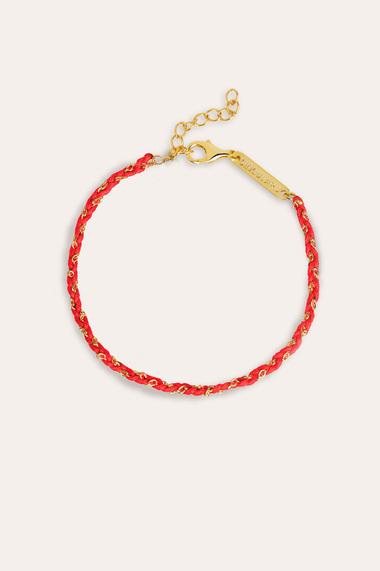 Pulseira de fio banhada a ouro e prata nas cores vermelho e branco.