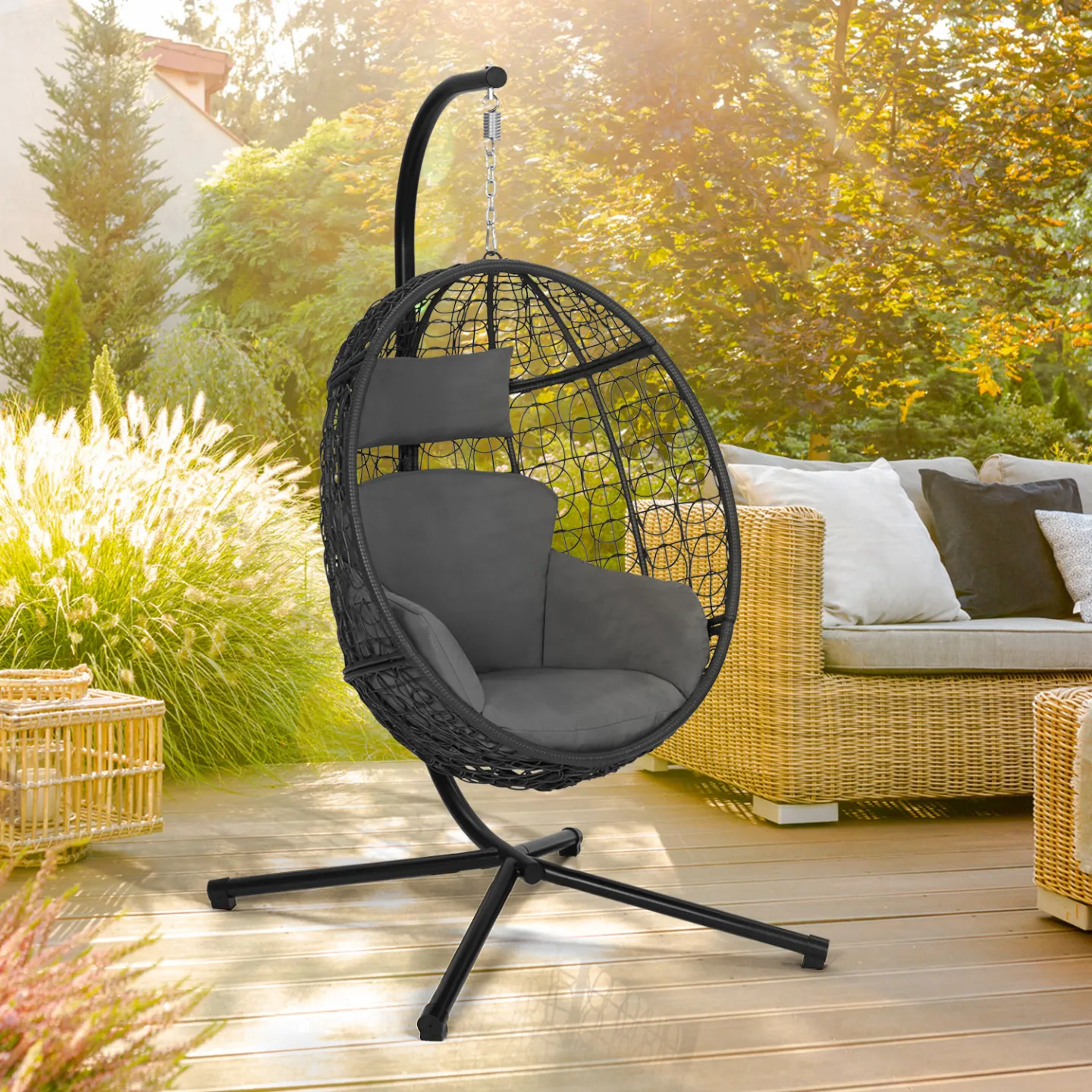 Fauteuil oeuf suspendu ajouré effet rotin gris avec coussin gris