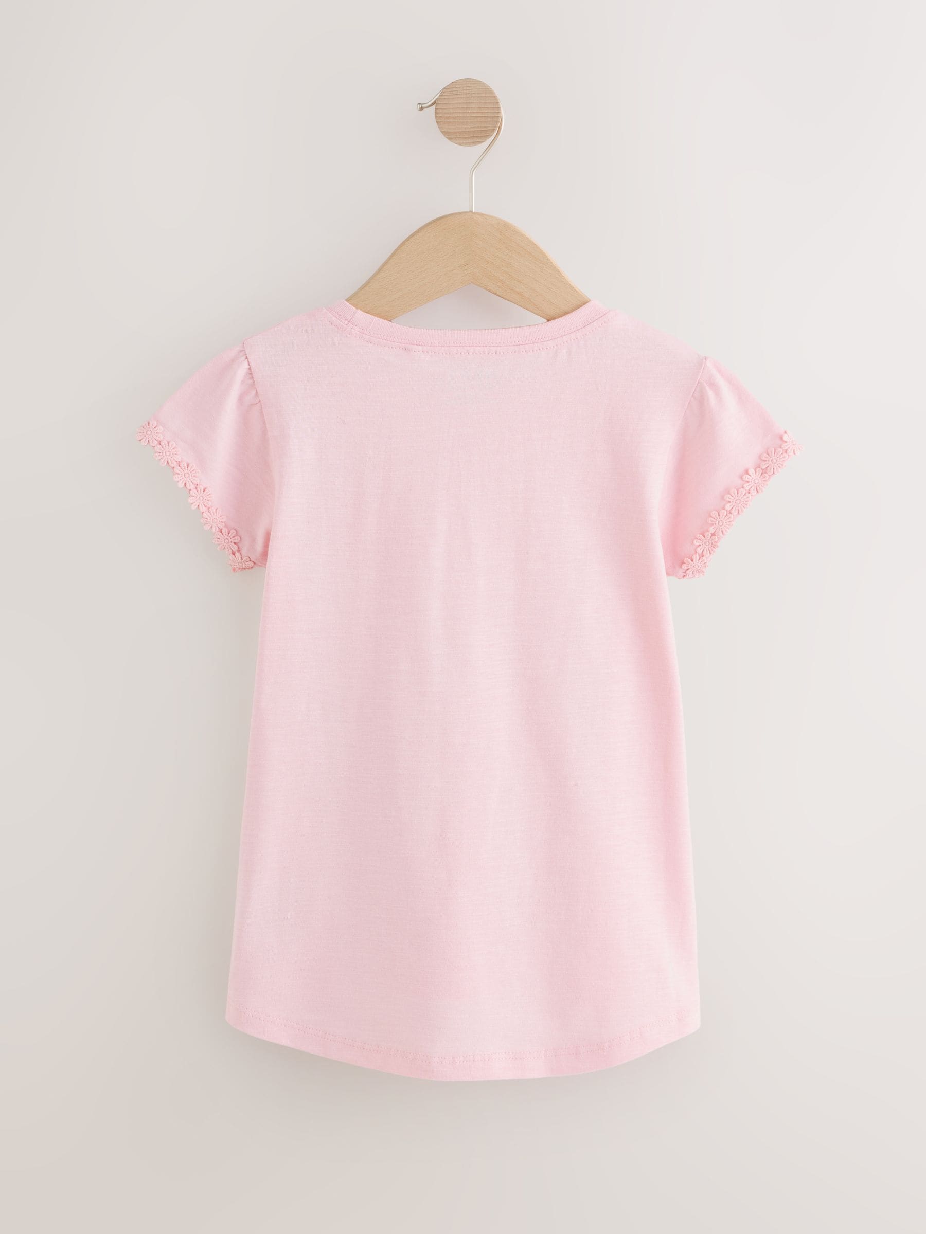 Roze - T-shirt met zakje en madeliefjesprint (1,5-16 jr)
