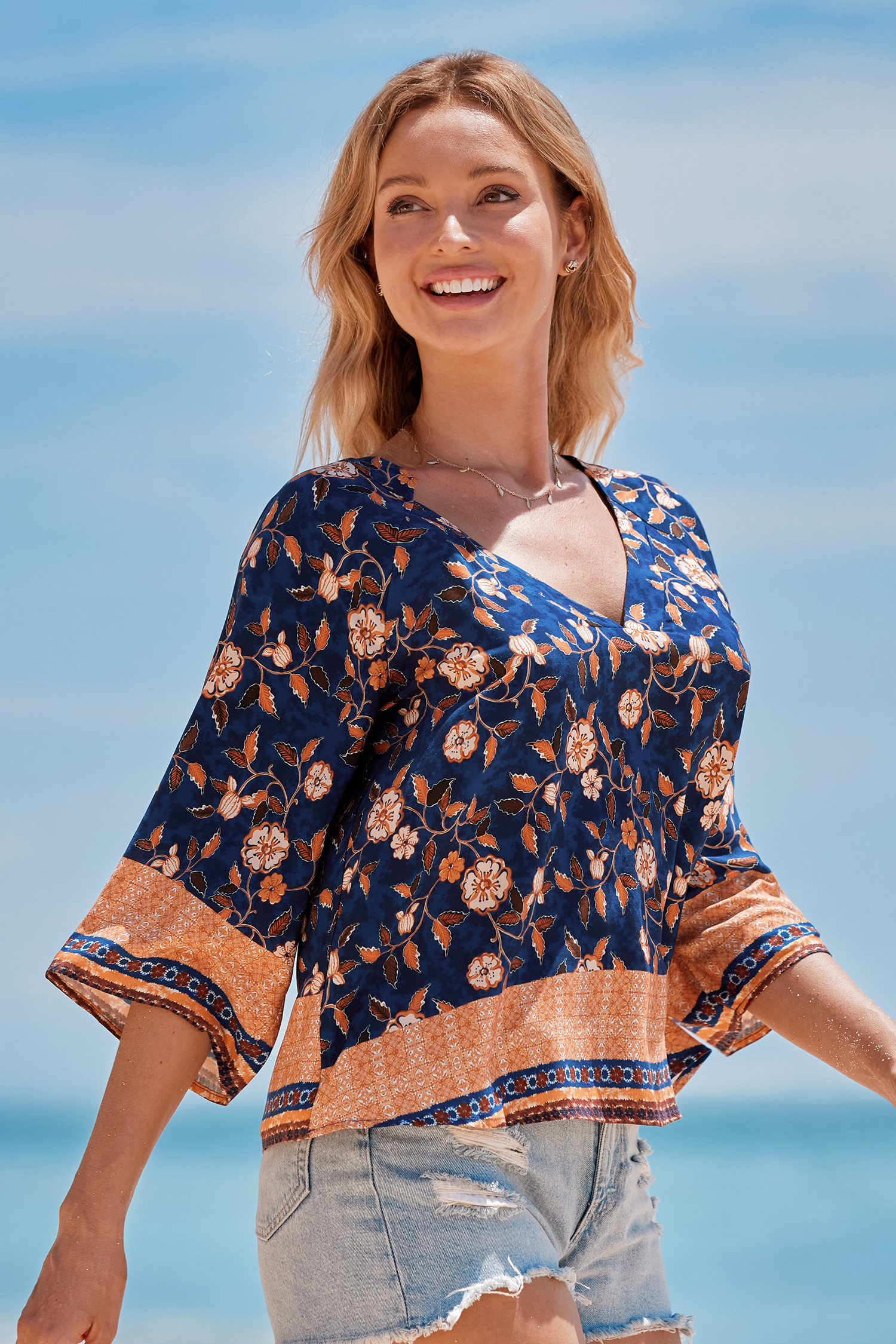 Haut blouson à fleurs bleu et orange