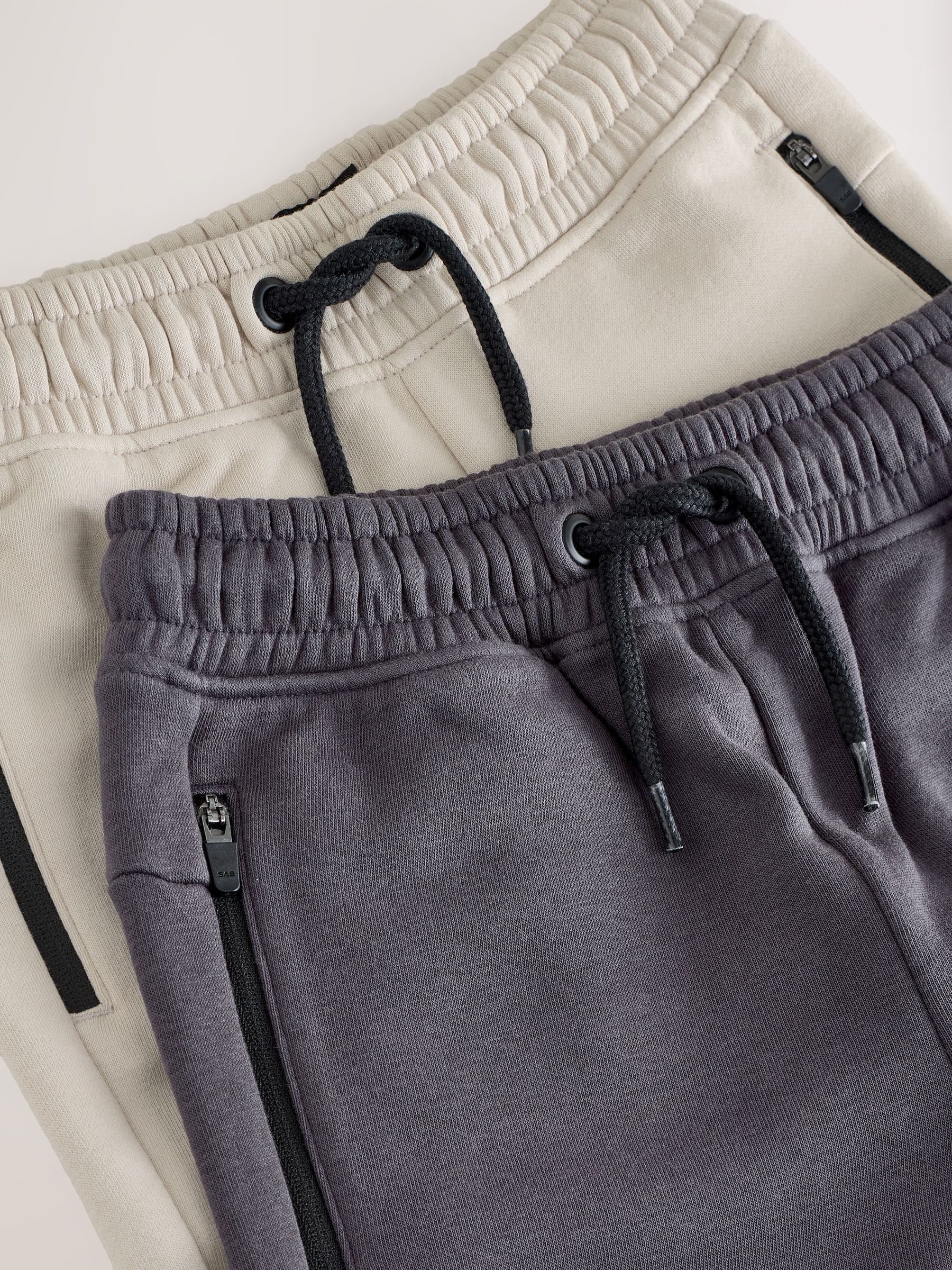Steen/grijs - Slim-fit joggingbroek met ritszak (3-16jr)