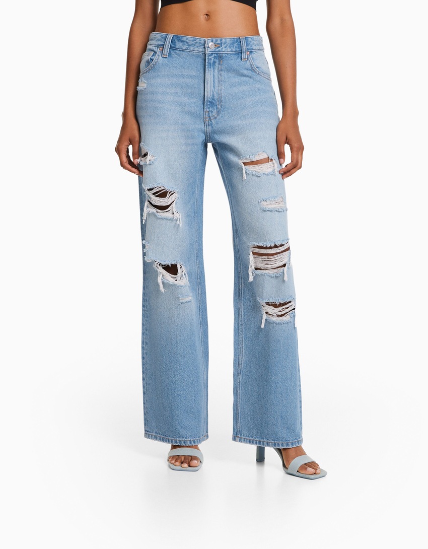 Calça jeans rasgada de perna larga dos anos 90