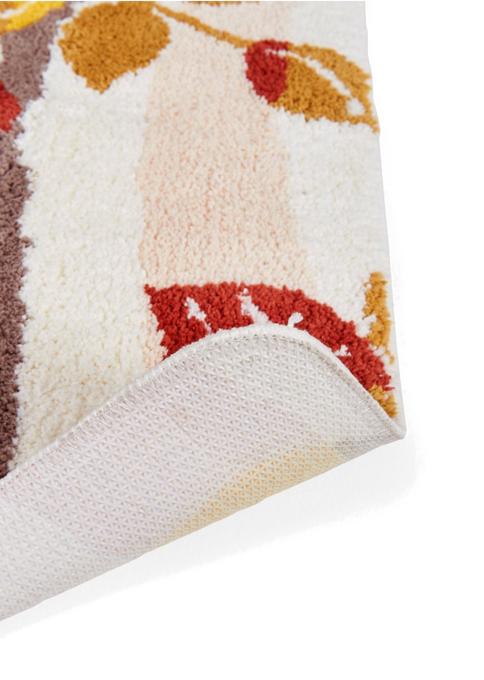 Tapis de salle de bain tufté en tons chauds