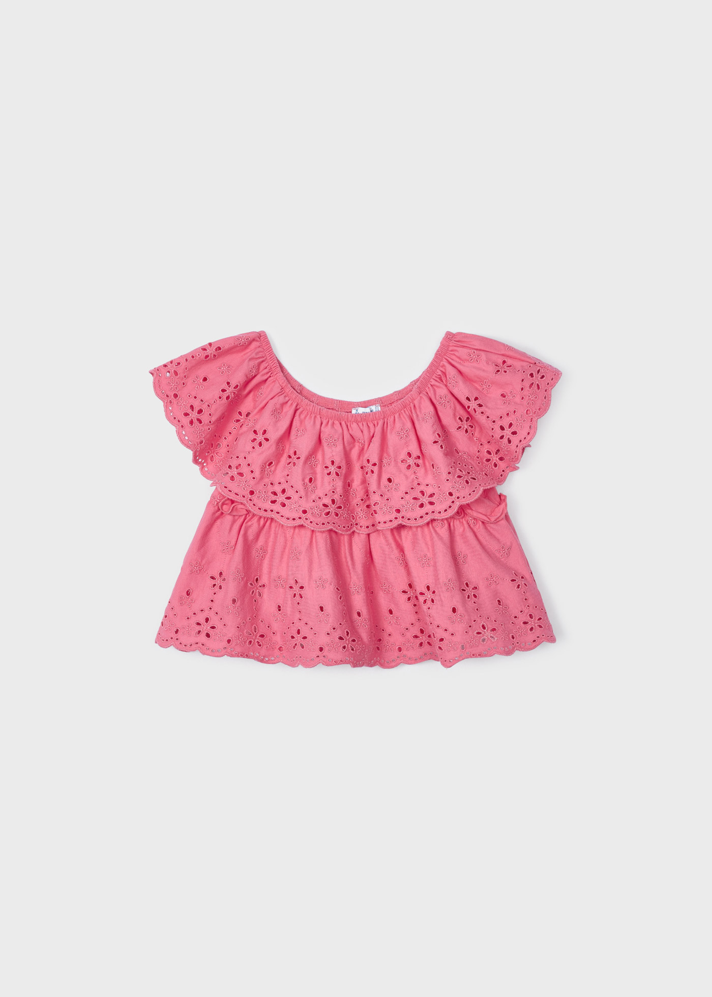 Blusa com motivos perfurados, feita de algodão sustentável, para meninas.