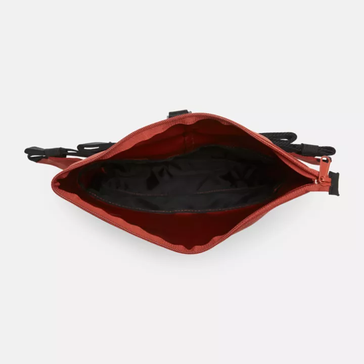 Bolsa transversal unissex para caminhadas na cor vermelha.