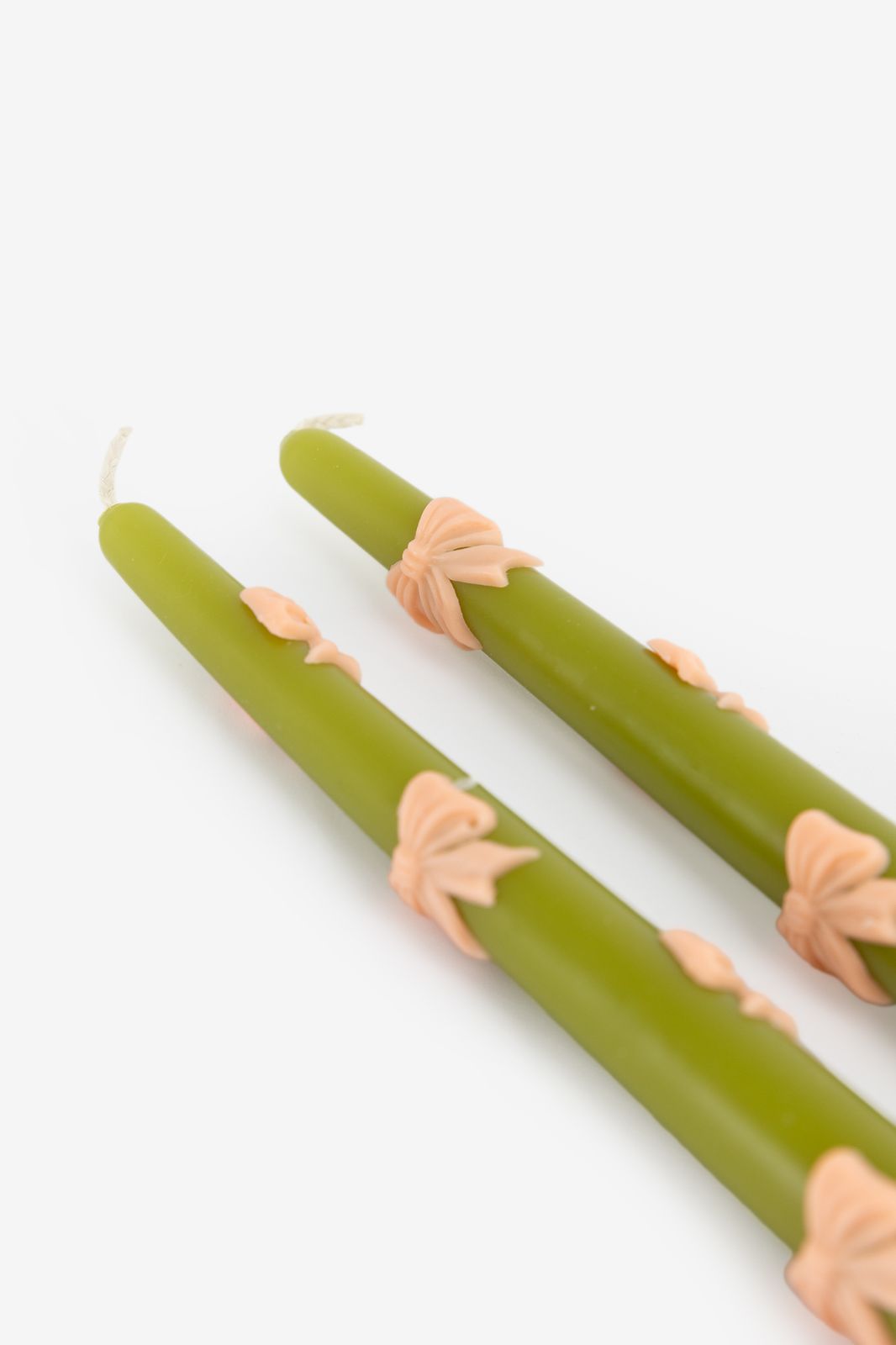Groene sierkaarsen met strikjes