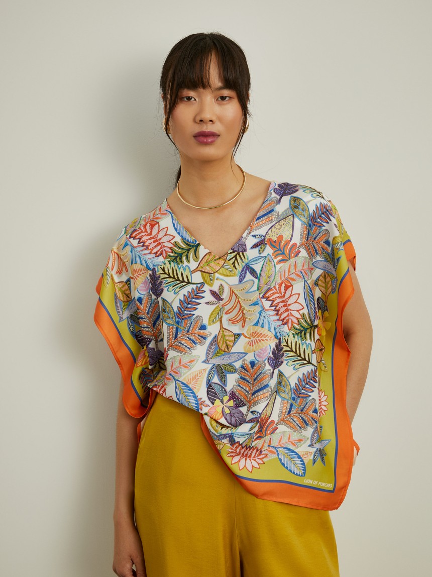 Blusa estilo poncho com padrão tropical