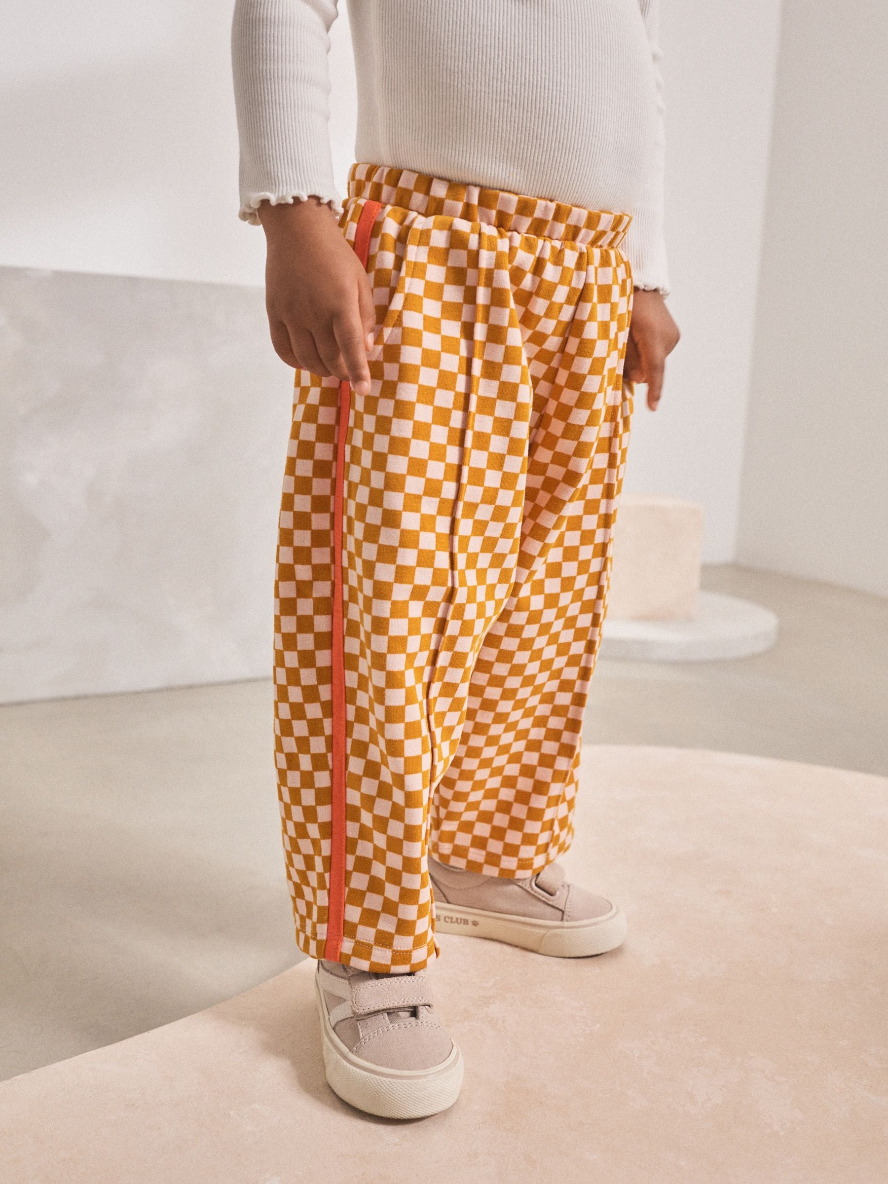 Oranje met dambordmotief - Broek met wijde kortere pijpen (3mnd -7jr)